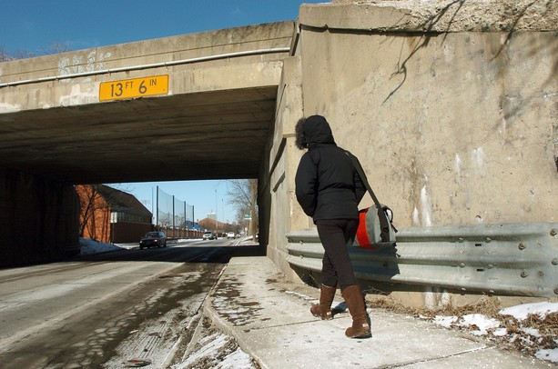 A pedestrian walks down State Street under the Stadium Blvd. bridge Wednesday afternoon, February 7, 2007 in Ann Arbor. Lon Horwedel, The Ann Arbor News